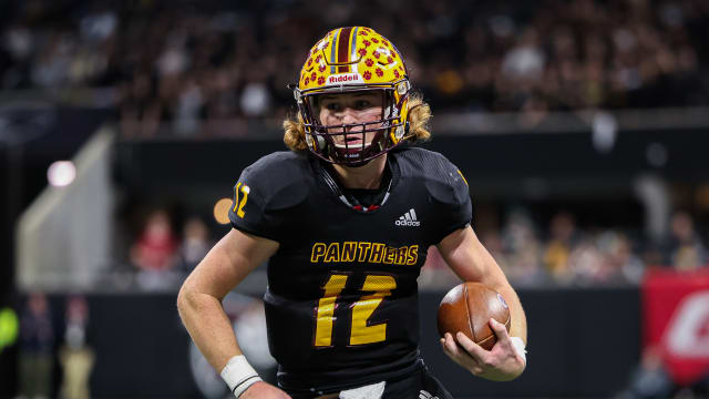 Perry quarterback Colter Ginn is focused as he scrambles for a first down during the Panthers win over Stockbridge in the Georgia 4A state championship game. 12/12/2023